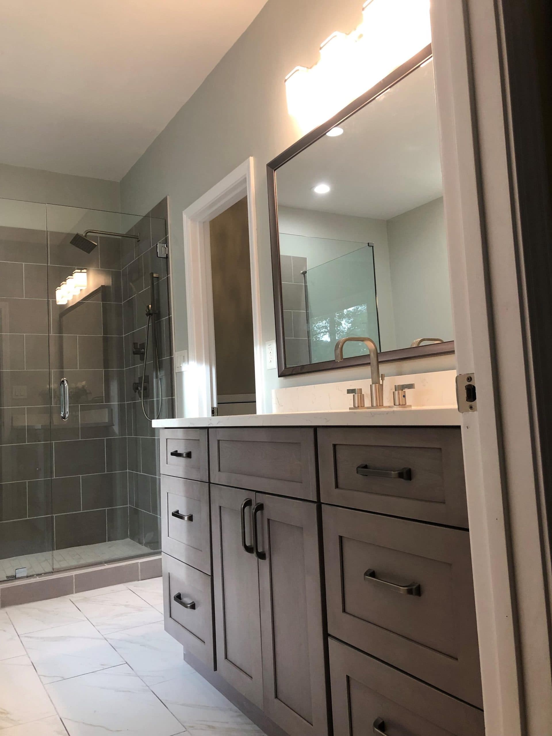 Bathroom remodel with a tiled walk-in glass shower