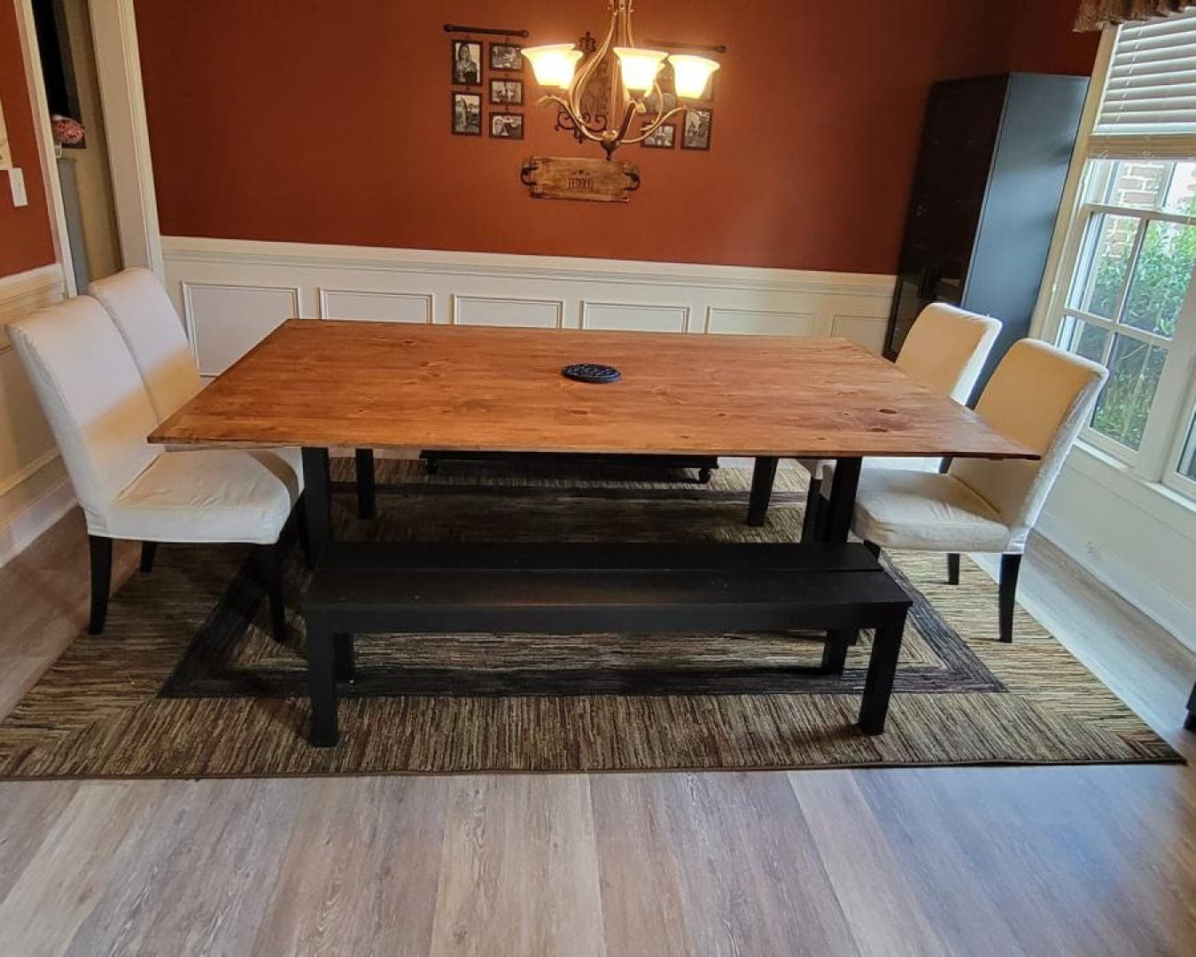 Dining room with new luxury vinyl plank flooring and trim